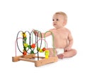 Cute baby with educational toy. Crawling time