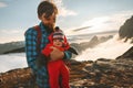 Cute baby with father traveling in mountains family tourism vacations together