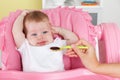 Cute baby is full of baby food Royalty Free Stock Photo