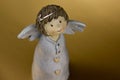 Cute baby girl angel statuette stock images