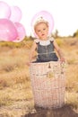 Cute baby girl with balloons outdoors Royalty Free Stock Photo