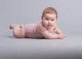 Cute baby girl crawling on the floor Royalty Free Stock Photo