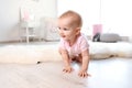 Cute baby girl crawling on floor Royalty Free Stock Photo