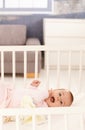 Cute baby girl in crib Royalty Free Stock Photo