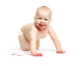 Cute baby girl dirty after eating berries crawling over white Royalty Free Stock Photo