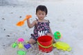Cute baby girl enjoying sand toys on the beach. Royalty Free Stock Photo