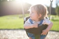 Cute baby girl having fun on a swing Royalty Free Stock Photo