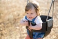 Cute baby girl having fun on a swing Royalty Free Stock Photo