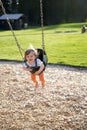 Cute baby girl having fun on a swing Royalty Free Stock Photo