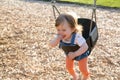 Cute baby girl having fun on a swing Royalty Free Stock Photo