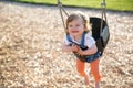 Cute baby girl having fun on a swing Royalty Free Stock Photo