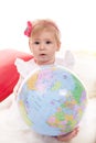 Cute baby girl holding world globe Royalty Free Stock Photo