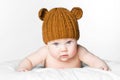 Cute baby girl in knitted cap teddy bear. concept of skin care of newborn child. Royalty Free Stock Photo