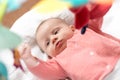 Cute baby girl playing with playmat toys Royalty Free Stock Photo