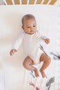 Cute Baby Girl Lying in the Crib. Royalty Free Stock Photo