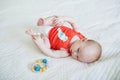 Cute baby girl lying on her back on bed Royalty Free Stock Photo