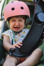 Cute Baby Girl with Pink Helmet Crying