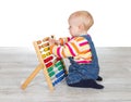 Cute baby girl playing with an abacus Royalty Free Stock Photo