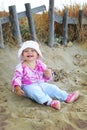 Cute baby girl playing on the beach Royalty Free Stock Photo
