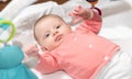 Cute baby girl playing with playmat toys Royalty Free Stock Photo