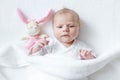 Cute baby girl playing with plush animal toy Royalty Free Stock Photo