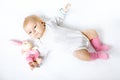 Cute baby girl playing with plush animal toy Royalty Free Stock Photo