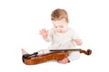 Cute baby girl playing with a violin Royalty Free Stock Photo