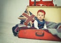 Cute Baby girl sitting in old vintage suitcase Royalty Free Stock Photo