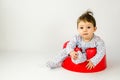 Cute baby girl sitting in a plastic seat Royalty Free Stock Photo