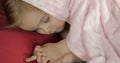 Cute baby sleeping on the bed at home. Little girl sleeping in morning light