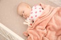 Cute baby girl sleeping in crib. Bedtime