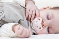 Cute baby girl sleeping over white bedcover Royalty Free Stock Photo