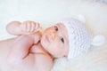 Cute Baby Girl Smiling and Wearing a Soft Knit Bear Ears Hat Royalty Free Stock Photo