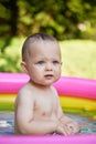 cute baby girl swimming in kid inflatable pool Royalty Free Stock Photo