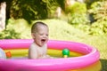 cute baby girl swimming in kid inflatable pool Royalty Free Stock Photo