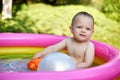 cute baby girl swimming in kid inflatable pool Royalty Free Stock Photo