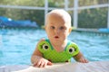 Cute Baby Girl in Swimming Pool on Summer Day Royalty Free Stock Photo