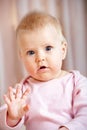 Cute baby girl waving hello/goodbye Royalty Free Stock Photo