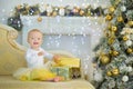 Cute baby girl 1-2 year old sitting on floor with pink balloons in room over white. Isolated. Birthday party. Celebration. Happy b Royalty Free Stock Photo