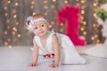 Cute baby girl 1-2 year old sitting on floor with pink balloons in room over white. Isolated. Birthday party. Celebration. Happy b Royalty Free Stock Photo