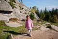 Cute baby girll in mountains. Little discoverer