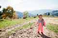 Cute baby girll waliking in mountains. Little discoverer