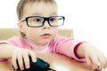 Cute baby with glasses looking into the laptop Royalty Free Stock Photo