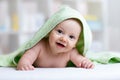 Cute baby in green towel after bathing Royalty Free Stock Photo