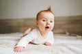Cute baby infant crawling at home curious child