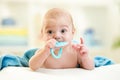 Cute baby with teether toy after bathing Royalty Free Stock Photo