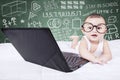 Cute baby with laptop and scribble background Royalty Free Stock Photo