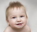 Portrait of a cute smiling baby that showing first milk or temporary teeth Royalty Free Stock Photo