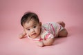 Baby laying on her belly in studio Royalty Free Stock Photo