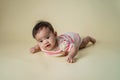 Baby laying on her belly in studio Royalty Free Stock Photo